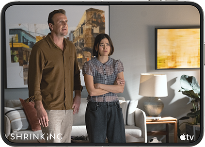 iPhone Duo, opened in horizontal position, Apple TV show "Shrinking" plays on screen