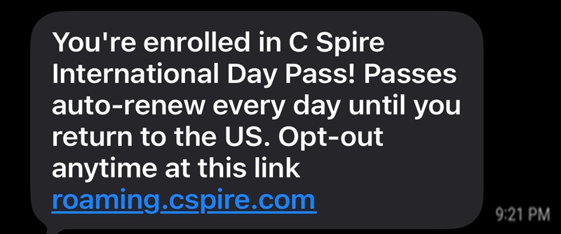 Text message indicating that the International Day Pass purchase was successful. There's also a link to cancel the Pass if necessary.