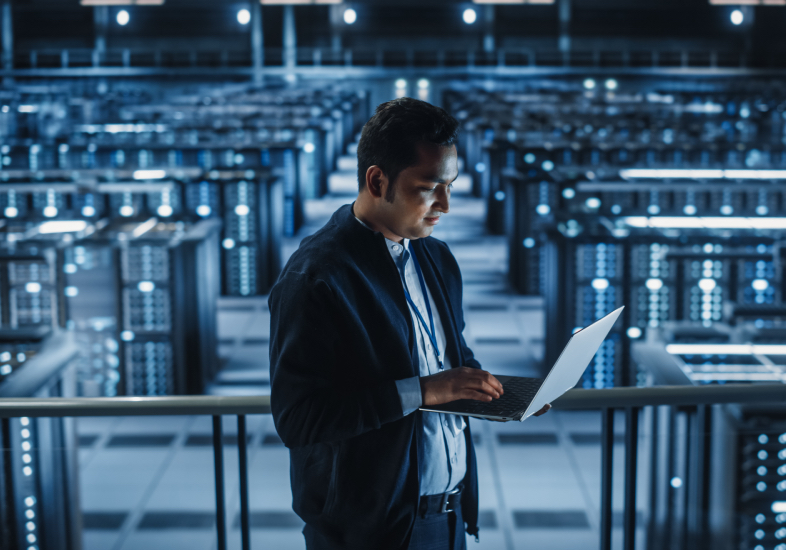 IT personnel on laptop